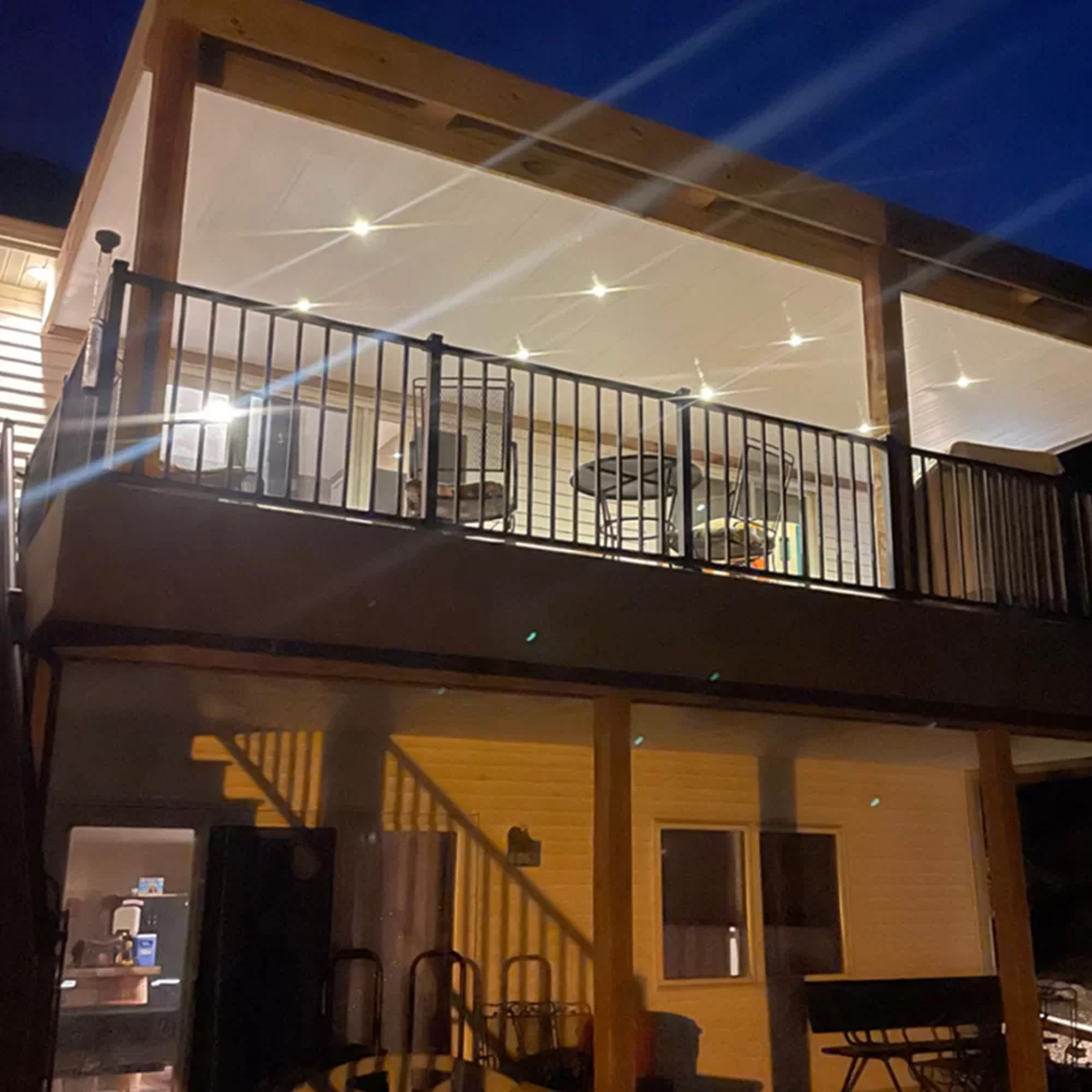downward deck lighting installation on second story balcony